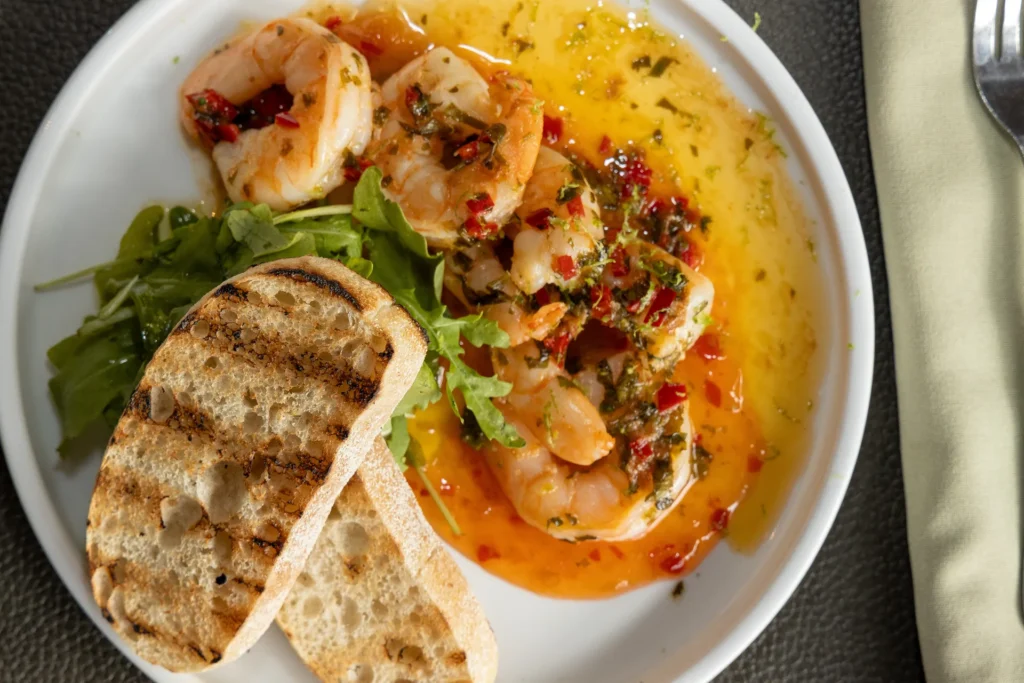 Prawns in chilli and garlic oil with toasted bread