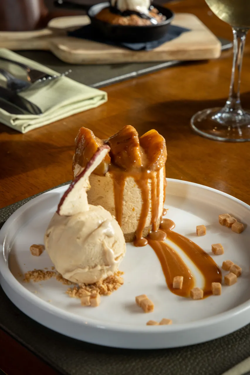 Sponge pudding with caramel sauce, ice cream and a dried apple crisp at The Old Red Lion, Horseheath