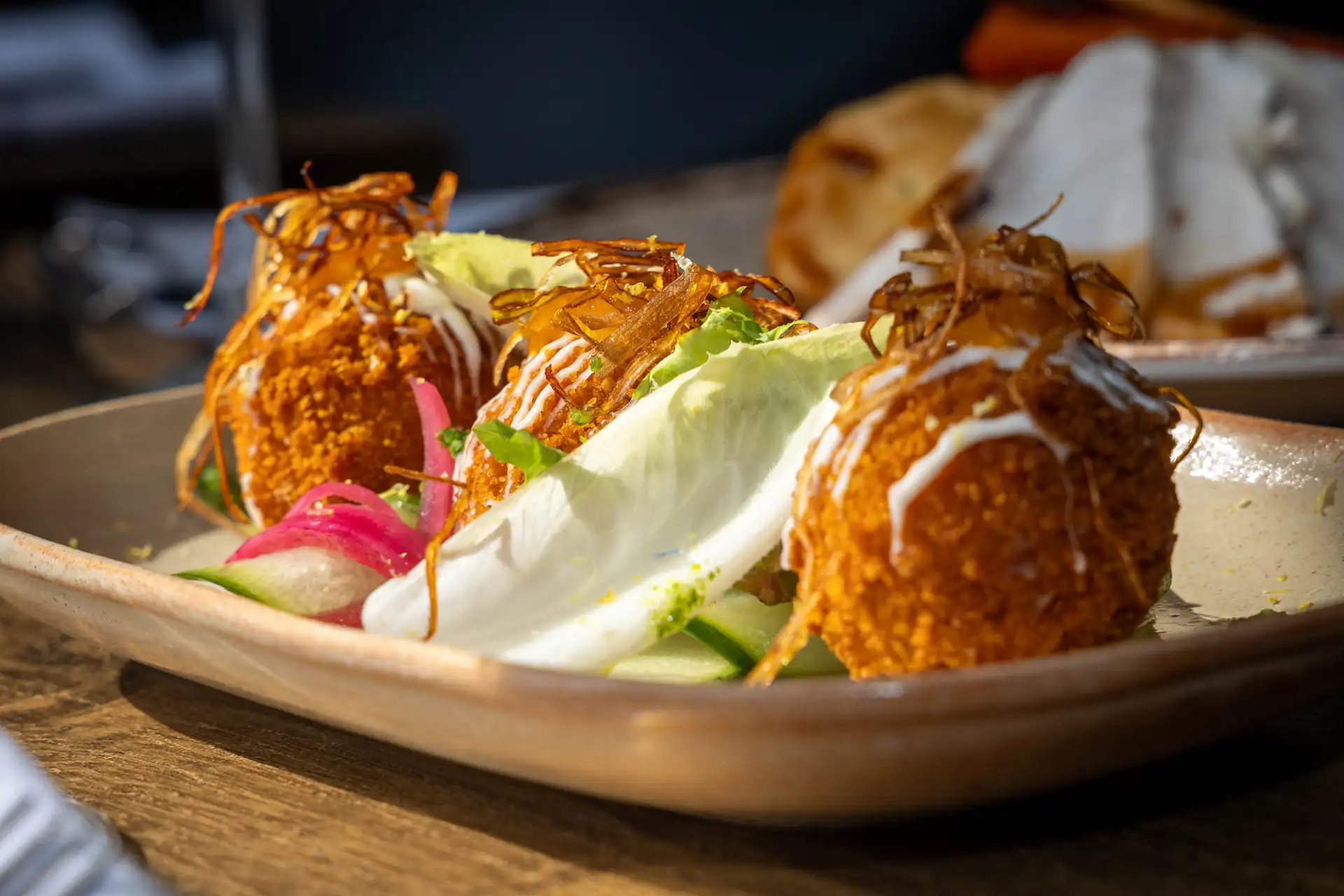 Smoked Haddock & Spring Onion Croquettes with Lemon Mayo & Grated Cured Egg Yolk, served on a stoneware dish, at The Old Red Lion, Horseheath