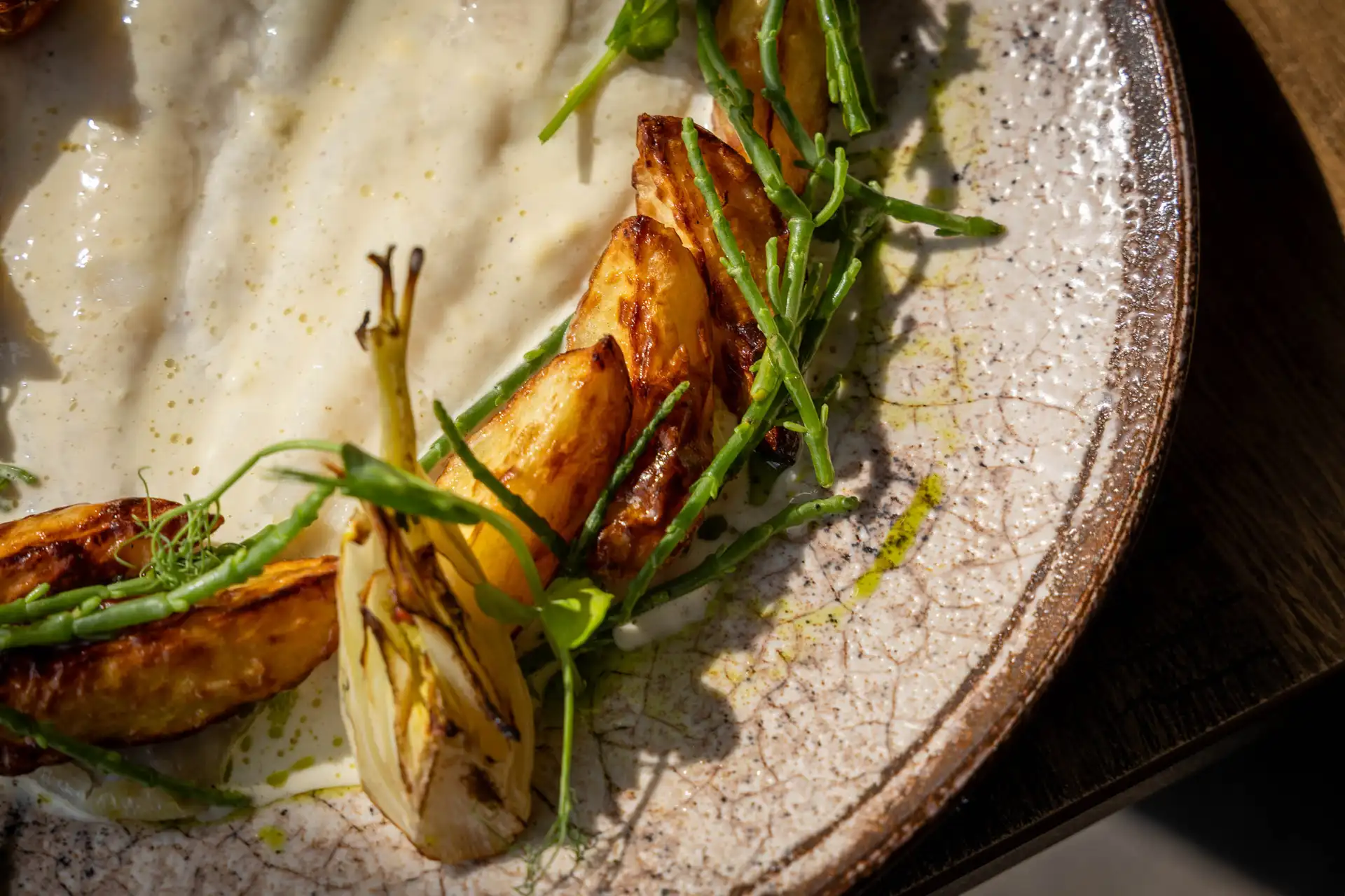 Close-up of roasted lemon sole with braised baby fennel and samphire, at The Old Red Lion, Horseheath